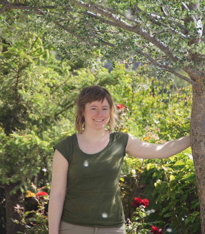 PhD student Laurence Fazan in front of a planted Zelkova abelicea tree in a private garden in western Crete. PhD student Laurence Fazan in front of a planted Zelkova abelicea tree in a private garden in western Crete.